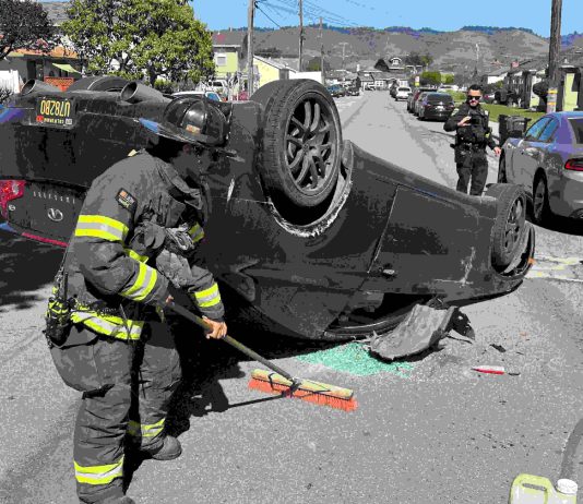 Photo Story: Two-vehicle crash on Center Street A Watsonville firefighter cleans up at the scene of a two-vehicle crash Tuesday afternoon on Center Street in Watsonville.