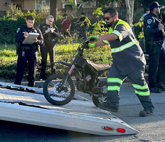 Photo story: Two teens arrested after e-bike chase A tow operator lifts one of two electric dirt bikes onto a flatbed truck after being stopped by Watsonville Police