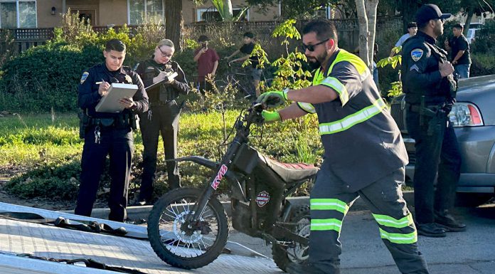 Photo story: Two teens arrested after e-bike chase A tow operator lifts one of two electric dirt bikes onto a flatbed truck after being stopped by Watsonville Police