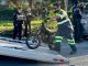 A tow operator lifts one of two electric dirt bikes onto a flatbed truck after being stopped by Watsonville Police
