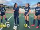 Gina Castañeda (second from left) works with the girls varsity soccer team at Aptos High School