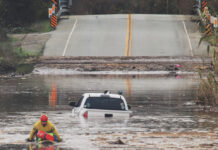 County prepares for potentially strong El Niño A State Parks Rescue swimmer paddles to shore from a pickup that stalled in flood water on Paulsen Road in 2023. New funding could help prevent this annual event.