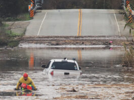 County prepares for potentially strong El Niño A State Parks Rescue swimmer paddles to shore from a pickup that stalled in flood water on Paulsen Road in 2023. New funding could help prevent this annual event.